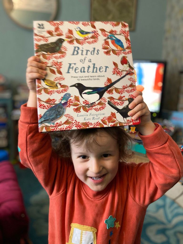 Ruan holding Birds of a feather book